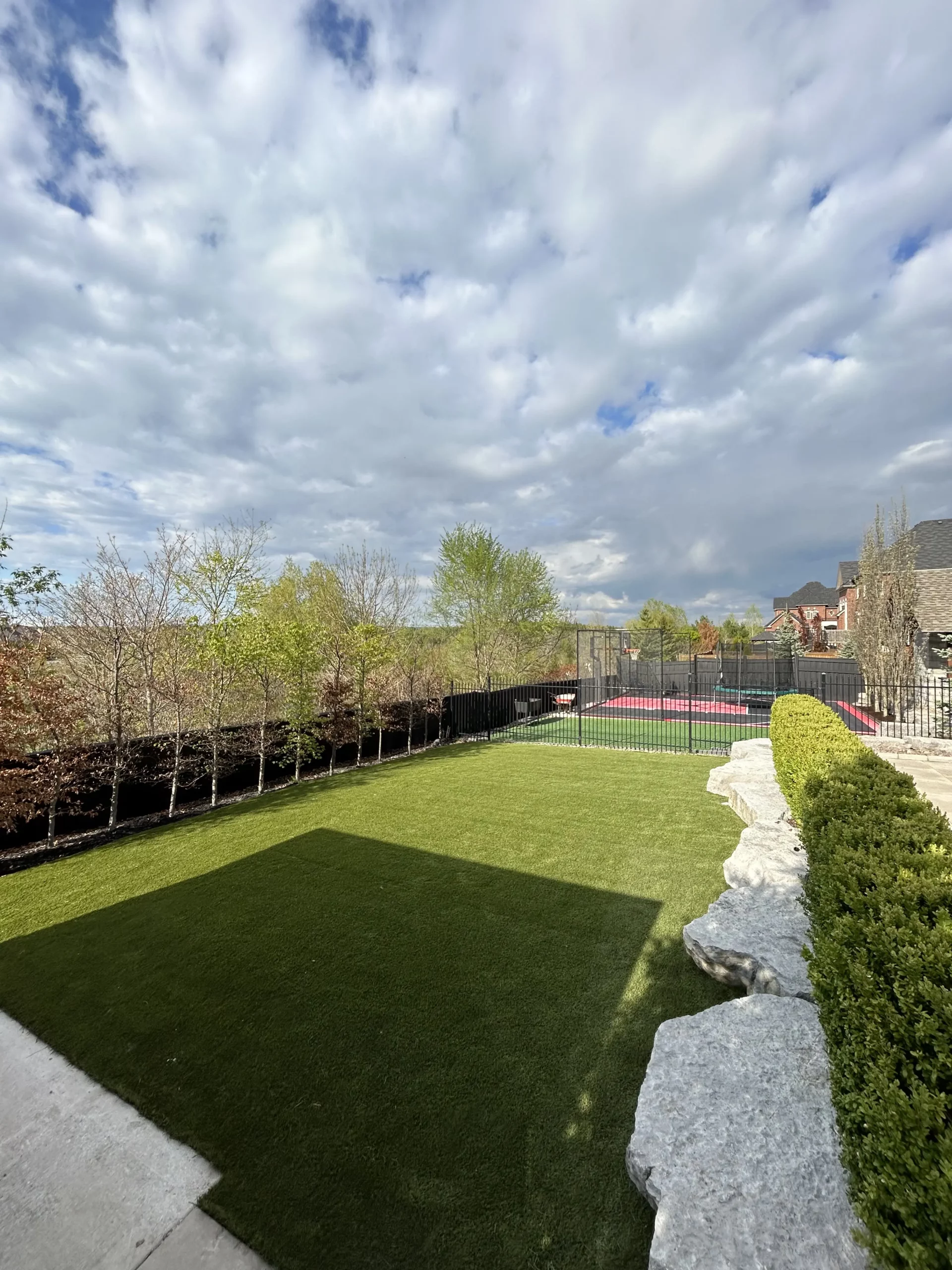 Backyard artificial grass installation in Pickering