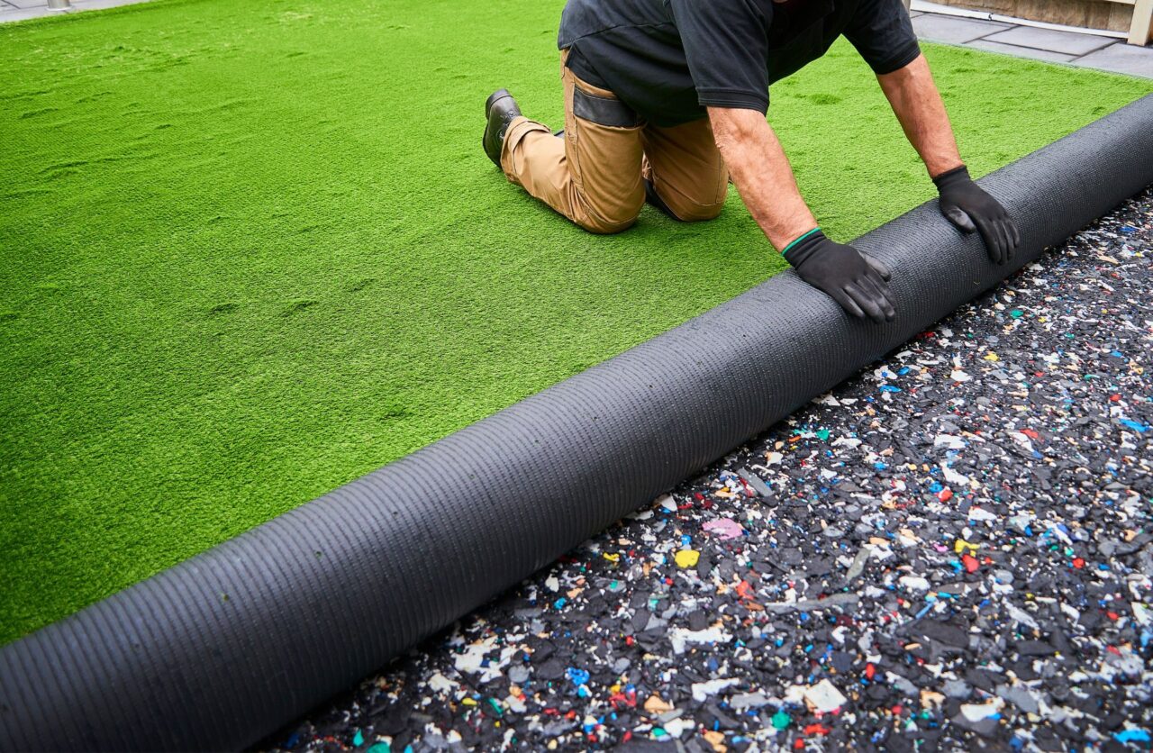Installing artificial grass in a Pickering backyard